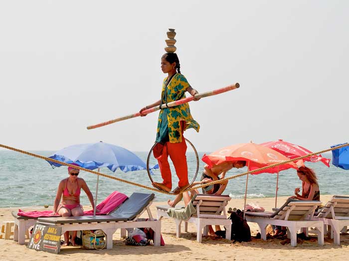Cheap Flights - Tightrope Walking on Anjuna Beach